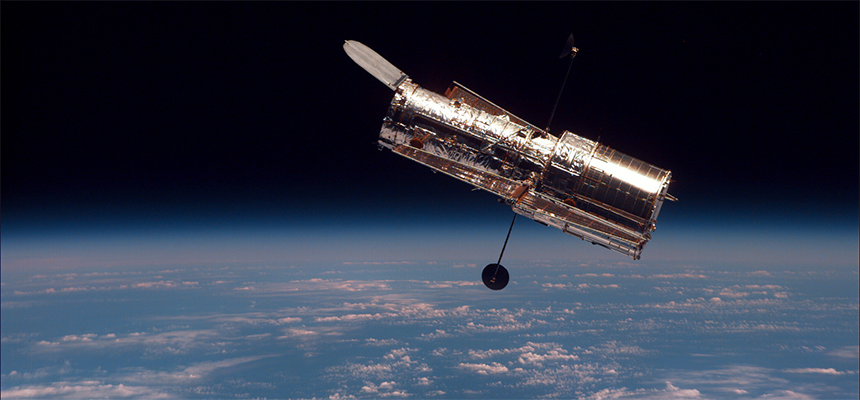 Hubble as seen from Discovery during its second servicing mission