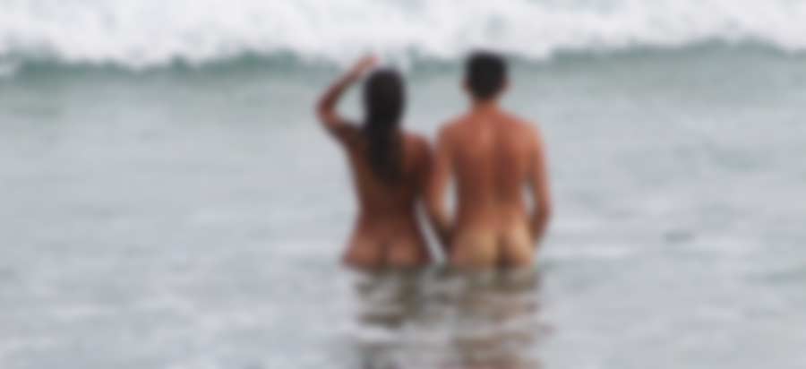 Man and woman in water naked.